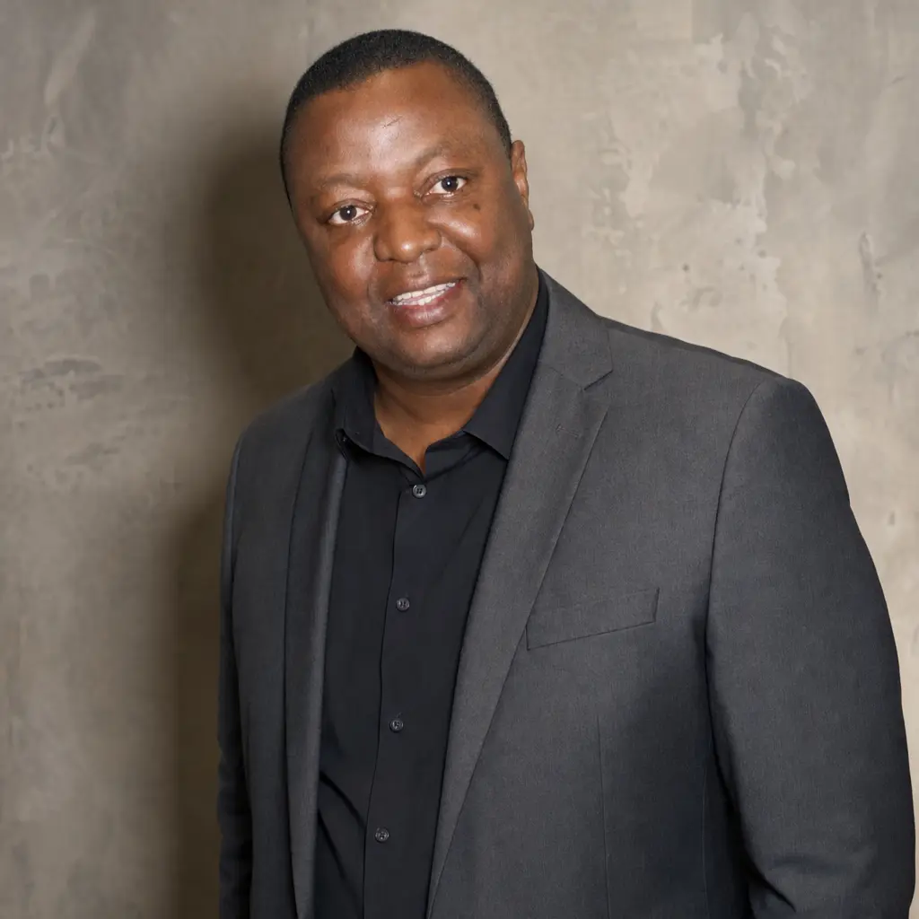 Professional portrait of Lloyd Munyaviri, operational leadership consultant and accredited coach
